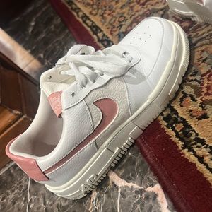 Pink and white Nike shadow forces